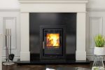 A lighting henley Eco c400 casette insert stove set into a black granite and white marble fireplace